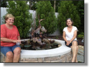 Beverlye with her niece next to the Chicago Heron fountain she bought recently. 