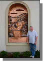 Tuscan copper wall fountain on other side of entrance.