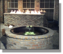 Kettle used as insert for brickwork on patio