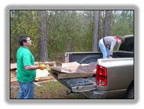 Jamie and Amelia unloading copper sheets from the pallet