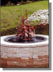 Fiberglass sugar kettle used as insert in nice pond setting in Maine