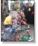 Buddy working on copper heron fountain